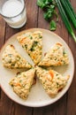 Savory scones with feta and mozarella and green herbs on a plate