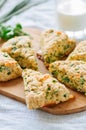 Savory scones with feta and mozarella and green herbs on a woode Royalty Free Stock Photo