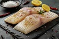 Savory seafood dish Pangasius fillet with lemon and spices