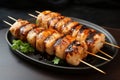 Savory skewer Grilled tube shaped fish paste cake or squid delicacy