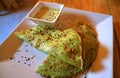 Savory Spinach Crepes with Green Mustard Sauce Served on Wooden Table