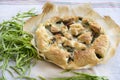 Savory tart stuffed with vegetables on baking parchment