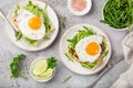 Savory waffles with avocado, arugula and fried egg for breakfast Royalty Free Stock Photo