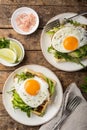 Savory waffles with avocado, arugula and fried egg for breakfast Royalty Free Stock Photo