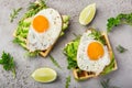 Savory waffles with avocado, arugula and fried egg for breakfast Royalty Free Stock Photo
