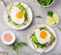 Savory waffles with avocado, arugula and fried egg for breakfast Royalty Free Stock Photo