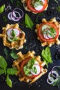 Savory waffles with cheese, ham, olives and herbs, served with f Royalty Free Stock Photo