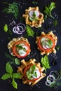 Savory waffles with cheese, ham, olives and herbs, served with f Royalty Free Stock Photo