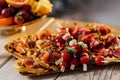 savory waffles with cheese, ham, olives and herbs, served with fresh vegetables. Black background, top view Royalty Free Stock Photo