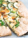 Savory zucchini and cheese galette on spelt dought, served with