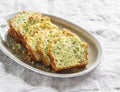 Savory zucchini, herbs, cheese snack cake on a light background, top view