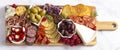 A Savoury Charcuterie Board Covered in Meats Olives Peppers Berries and Cheese Royalty Free Stock Photo