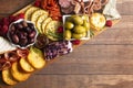 A Savoury Charcuterie Board Covered in Meats Olives Peppers Berries and Cheese Royalty Free Stock Photo