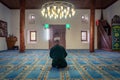 The imam reading Quran, holy book of Islam during Ramadan