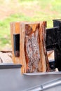 Saw cutting wood for winter. Modern machine lumber saw cutting firewood and logs. Wood industry. Royalty Free Stock Photo