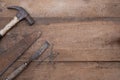 Saw hammer and chisel collection of old woodworking handtools on rough workbench wooden Royalty Free Stock Photo