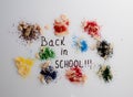 Sawdust from colored pencils around text return to school, work