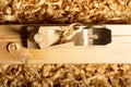 Sawdust and jack-plane on a wooden beam jack-plane