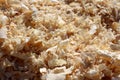 Light wood shavings in the joiner`s workshop after the sawn timber processing Royalty Free Stock Photo