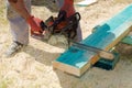 Sawing wooden beam