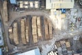 Sawmill aerial view chopped tree wood logs stacks in a row with machinery in Scotland