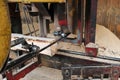 A sawmill cuts a tree trunk into planks. Processing wooden boards at a sawmill