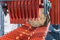 sawmill feeding flanges in woodworking machine at the sawmill Royalty Free Stock Photo