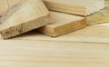 Sawn boards lie on the wooden surface.Construction materials from pine