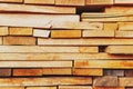 Sawn and folded boards, construction boards, full-screen lumber as a background