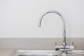 Sawn neck chrome kitchen sink close up Royalty Free Stock Photo