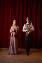 Sax man and woman fiddler duet