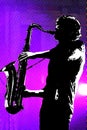 Sax player silhouetted.