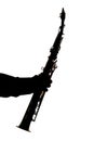 Saxafon on a white background in the hands of a musician silhouette