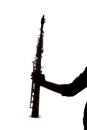Saxafon on a white background in the hands of a musician silhouette