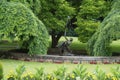 Original fountain in the green trees of terraced gardens in Prague