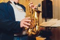 Saxophone classical music instrument Saxophonist with alto sax closeup on black.