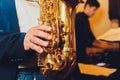 Saxophone classical music instrument Saxophonist with alto sax closeup on black.