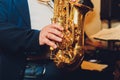 Saxophone classical music instrument Saxophonist with alto sax closeup on black.