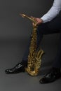 Saxophone classical music instrument Saxophonist with alto sax closeup Royalty Free Stock Photo