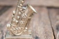 Saxophone for decorate old close up on vintage wooden background with copy space add text Royalty Free Stock Photo