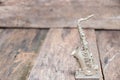 Saxophone for decorate old close up on vintage wooden background with copy space add text Royalty Free Stock Photo