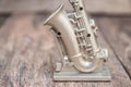 Saxophone for decorate old close up on vintage wooden background with copy space add text Royalty Free Stock Photo