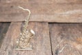 Saxophone for decorate old close up on vintage wooden background with copy space add text Royalty Free Stock Photo