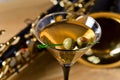 Saxophone and martini with green olives