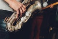 Saxophone player jazz musician. Saxophonist with baritone sax player. Royalty Free Stock Photo