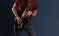 Saxophone Player Saxophonist playing jazz music. Sax alto Musician hands closeup Royalty Free Stock Photo