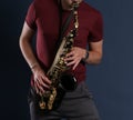 Saxophone Player Saxophonist playing jazz music. Sax alto Musician hands closeup Royalty Free Stock Photo