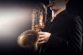 Saxophone player Saxophonist playing jazz sax baritone Royalty Free Stock Photo