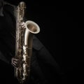 Saxophone player saxophonist with sax baritone Royalty Free Stock Photo