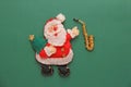 Saxophone and Santa Claus, Christmas card. Green background